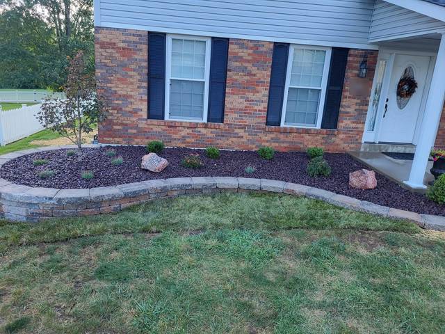 Low curving wall along the front of the house