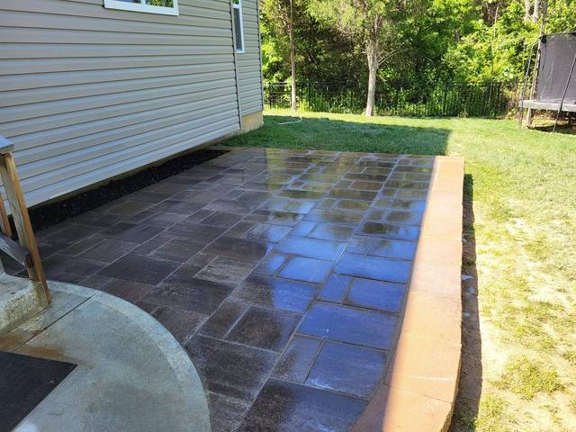 Small paver landing at a side door