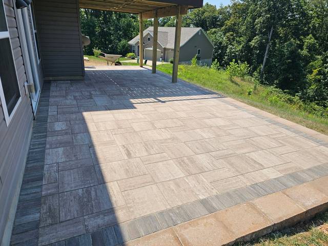 Patio beside the house with a dark border