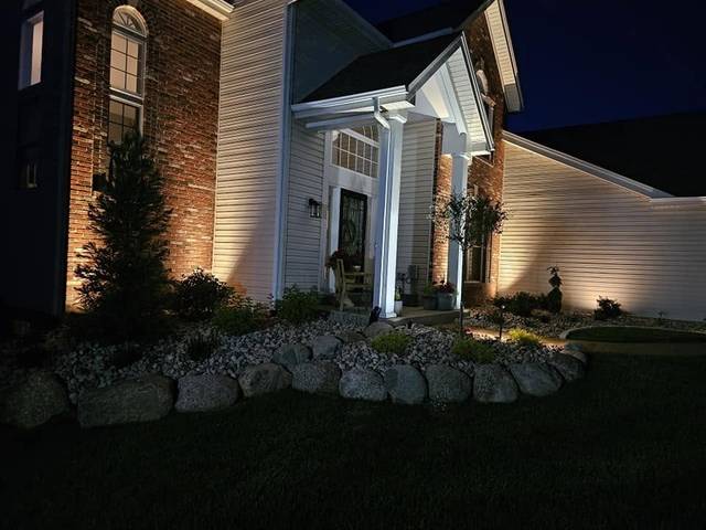 Uplights on the house front at night
