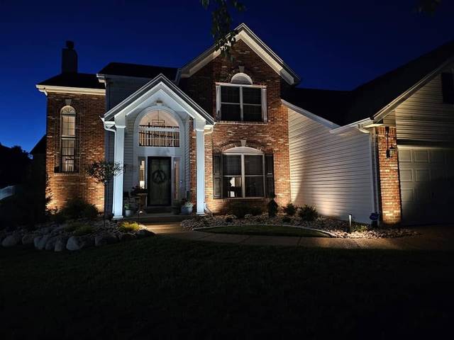 Front of the house lit at dusk