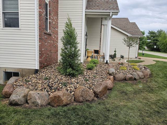 Boulder border around a rock bed